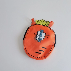 Close-up of orange carrot-shaped kids backpack with Ready Go design and green leaf detail