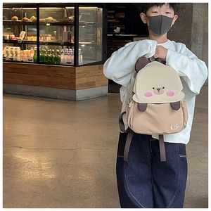 Boy wearing cute bear backpack with 3D ears and stylish color-block design