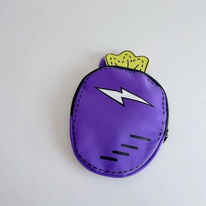 Detail of purple cartoon carrot backpack featuring white lightning patterns and yellow leaves
