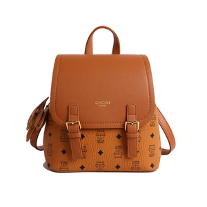 Brown monogram backpack with cat pattern and gold buckles on a white background