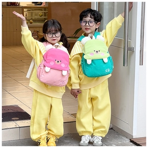 Close-up of pink and teal backpacks with cute 3D bear ears and side elastic pockets