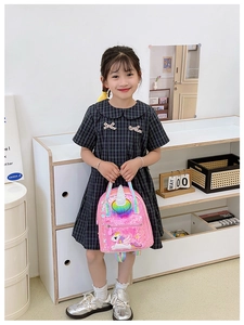 Close-up of pink sequin toddler backpack featuring unicorn horn and rainbow accents