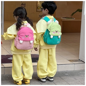 Detailed back view of children wearing cute 3D cartoon bear backpacks in pink and green