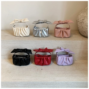 Detailed display of six colorful pleated cloud bags for girls with decorative bows