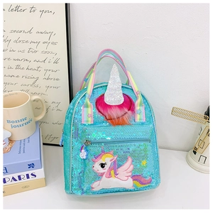 Detail of sequin unicorn backpack showing 3D horn, embroidery, and rainbow strap