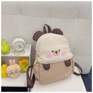 Detail of cute bear backpack for kids with 3D ears and high-quality nylon fabric texture