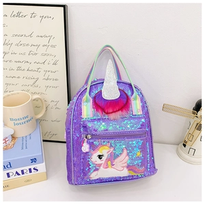 Close-up of purple sequin unicorn backpack with rainbow straps and 3D glittery horn detail