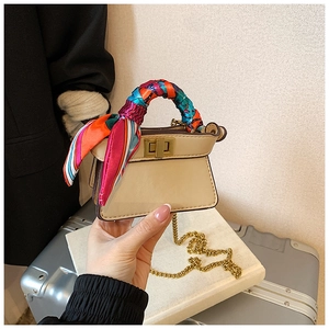 Mini beige tote with golden chain strap and colorful silk scarf handle detail