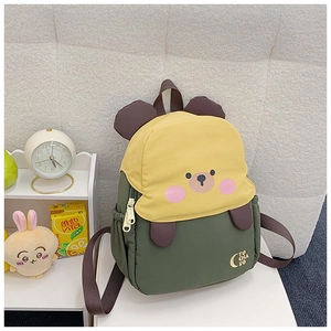 Detail of cute bear cartoon schoolbag with dual-tone yellow and green color scheme