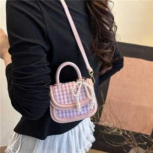Mini pink plaid handbag with pearl bow charm and crossbody strap for elegant women