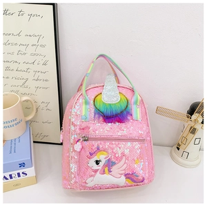 Close-up of glitter unicorn backpack with flip sequins and colorful rainbow handle