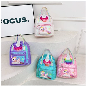 Detail showing colorful unicorn sequin backpacks with glitter horns and rainbow straps