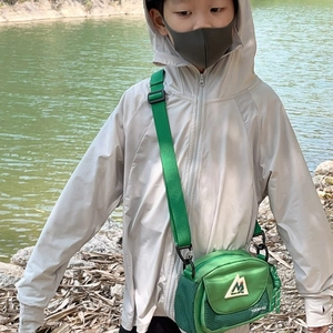 Kids green casual crossbody bag for outdoor activities with adjustable strap and logo