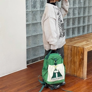 Kids casual green backpack with large capacity and stylish contrast color drawstring design