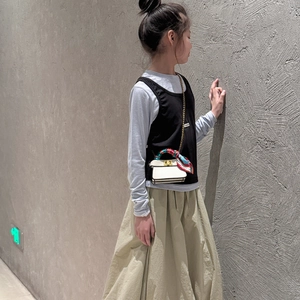 Mini white crossbody chain bag for girls featuring a silk scarf wrap and gold metal lock