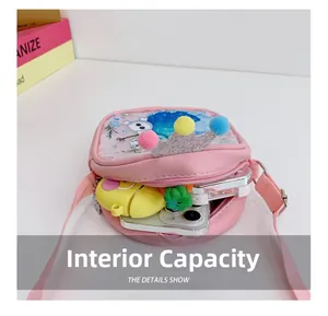Detail view of pink sequin girl's crossbody bag interior showing storage capacity