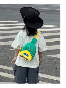 Macro detail of the cartoon car chest bag with green and yellow color contrast design