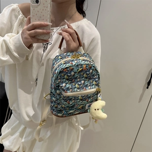 Mini navy blue backpack with marine prints and cute moon plush charm for daily travel