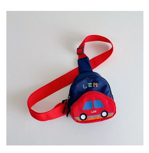 Detail showing adjustable red shoulder strap and zip closure on the cartoon car bag