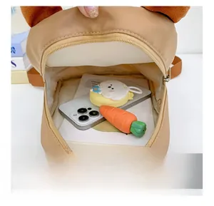 Detail showing the inner capacity of the cute cartoon toddler backpack for kids