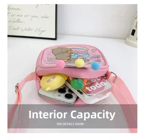 Internal capacity of pink cartoon crossbody bag showing space for phone and cosmetics