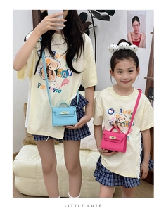 Detailed view of mini crossbody bags in light blue and rose red on child model