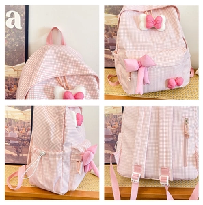 Detail view of pink plaid kids backpack with 3D bows showing front side and back views