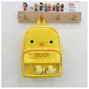Detail of yellow toddler backpack featuring duck face design and transparent front pocket