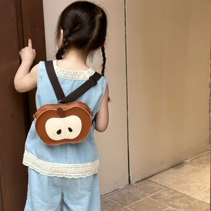 Rear view of a cute apple-shaped brown faux leather toddler backpack with straps