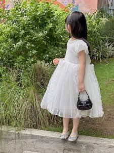Toddler princess outfit with white mesh dress, black bow handbag and silver glitter shoes