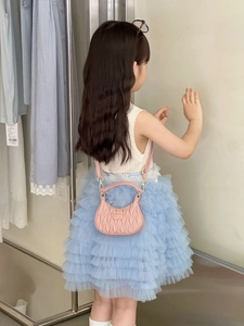 Pink quilted leather kids handbag with a stylish pleated finish and shoulder strap