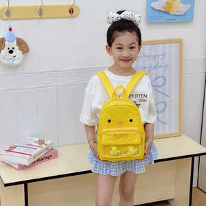 Cute yellow duckling backpack for kids with a transparent window and plush toys