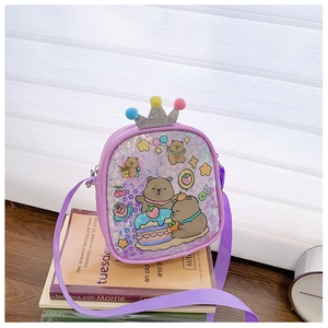 Detail of purple children crossbody bag with glitter finish and pompom crown decor