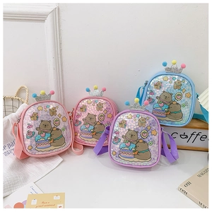 Glittering children's crossbody bags in pink, purple, and blue with cartoon bear prints