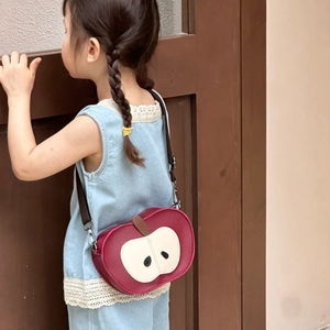 Cute red apple-shaped kids backpack with heart patch and adjustable brown strap