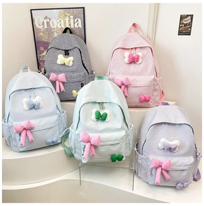 Detailed display of five colors of gingham schoolbags with 3D bow decorations for kids