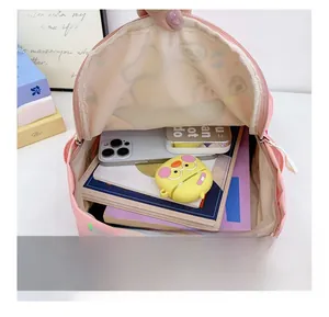 Interior view of pink polka dot kids backpack showing large storage capacity and main pocket