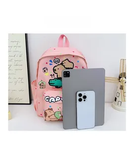 Pink Capybara backpack size comparison shown with an iPad and a mobile phone