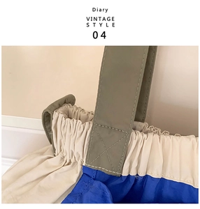 Detail of reinforced stitching and pleat texture on vintage contrast tote bag