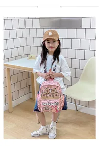 Detailed view of pink toddler backpack with cute capybara prints shown on a young girl