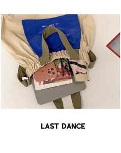 Large capacity drawstring tote showing storage for laptop, phone, and daily essentials