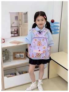 Girl wearing a purple plaid Capybara school bag with cute cartoon prints and side pockets