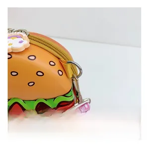 Close-up of the detachable metal hook and printed pink strap on silicone hamburger bag