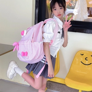 Pink checkered kids backpack with cute bow and bunny ears charm for school or casual use