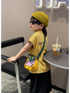 Close-up of a stylish yellow and purple drawstring mini shoulder bag for kids fashion