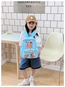 Detail view of light blue toddler backpack with cute capybara prints and large front pocket