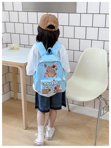 Detail of light blue toddler backpack with Capybara print and adjustable shoulder straps
