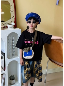 Kids streetwear set featuring black graphic tee with blue crossbody bag and accessories