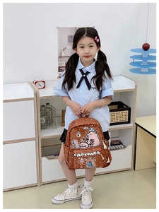 Polka dot children backpack with cute capybara prints shown by a little girl