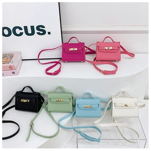 Mini crossbody bags for kids in six vibrant colors with lychee texture and metal clasps